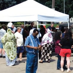 Image of people who have evacuated a building to a emergency assembly area 