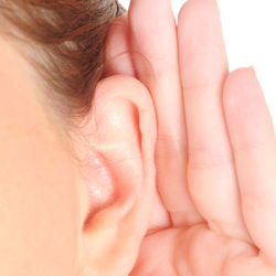 Image showing worker with hand cupped behind ear trying to hear better