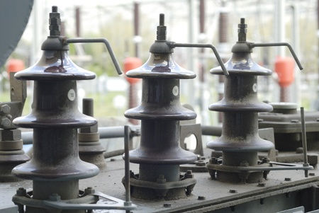 Electrical insulators on a transformer.