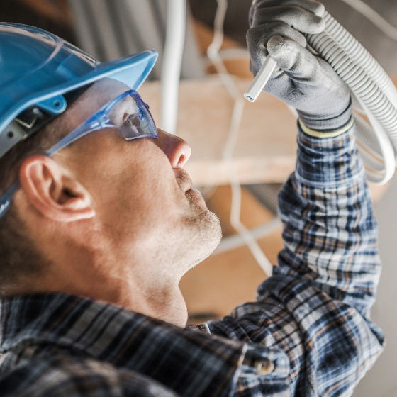 Electrician installing wiring