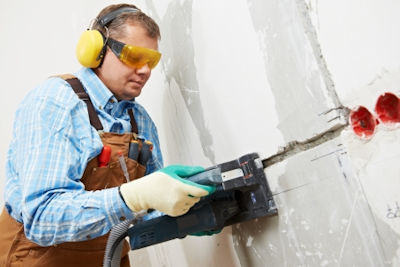 Worker using power tool that is properly grounded.