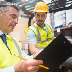 supervisor and employee discussing warehouse hazards