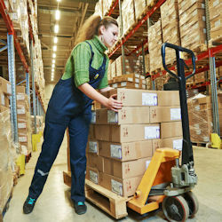 Worker lifting and twisting while lifting boxes.