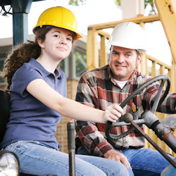 Supervisor training forklift worker.