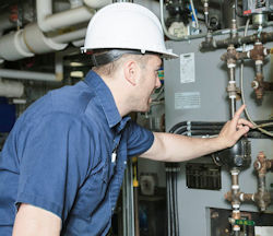 Worker performing preventive maintenance