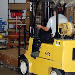 Operator driving a forklift