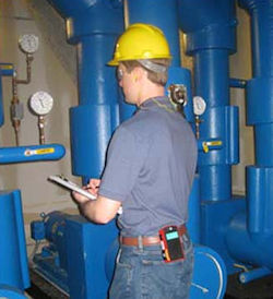 Noise dosimeter attached to a workers belt.