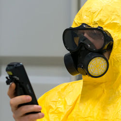 Worker wearing PPE testing for hazardous atmospheres