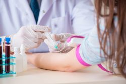 Patient giving blood for testing