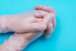 Showing picture of hands with non-latex gloves