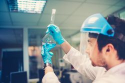 worker in lab with exposure to hazardous chemicals