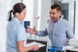 hospital worker being yelled at by visitor