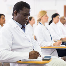 Healthcare staff being trained in classroom.