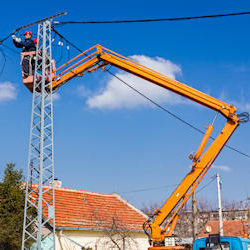 Aerial lift truck working on transmission line.