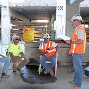 Employees meeting before a lift