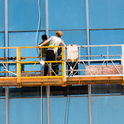 Workers washing windows.