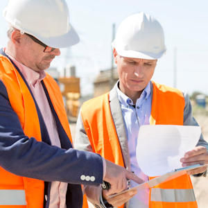 Two USACE Workers reviewing paperwork