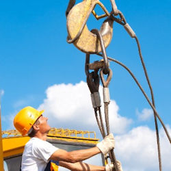 Worker inspecting rigging