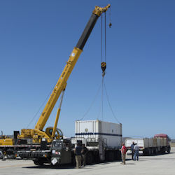 Big crane hoisting a large load