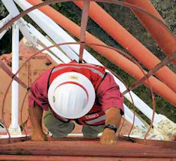 USACE worker climbing cage ladder