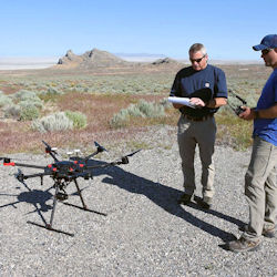 Workers performing maintenance on UAV