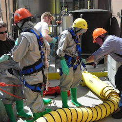 Workers preparing before entering a confined space