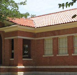 Brick school building with a clay tiled roof