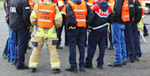 Group of safety professional and staff gathered in a group.