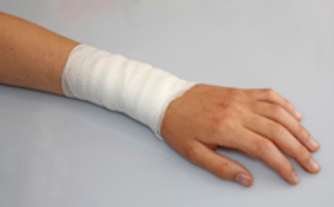 injured arm with bandage on lower section