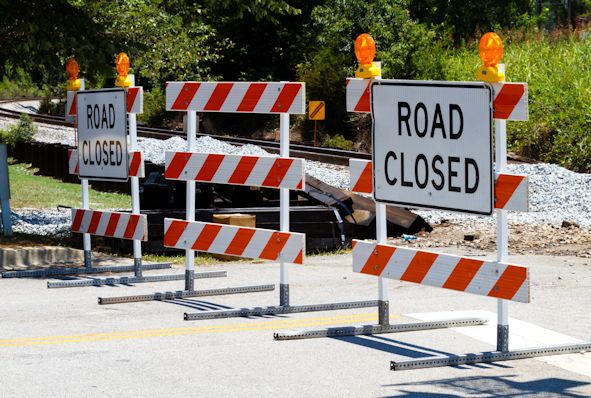 Three barricades showing Road Closed