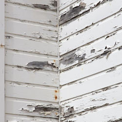 Exterior wall of building with chipping paint.