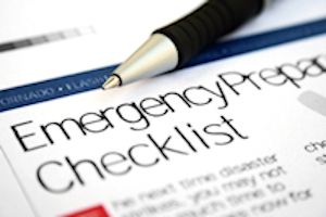 Pen sitting on a piece of paper with an emergency preparation checklist