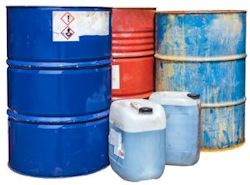 Three Barrells and two small plastic containers with hazardous material