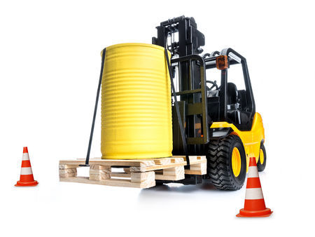 Forklift carrying a barrel on a pallet with two safety cones.