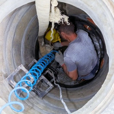 Man working in a confined space.