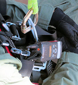 Confined space team member wearing gas sensor also known as sampling equipment.