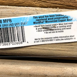 Treated wood with label