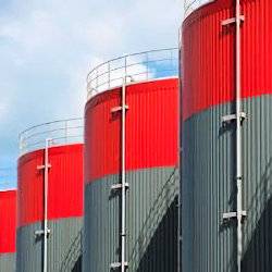 Picture of four storage tanks that are stationary process containers