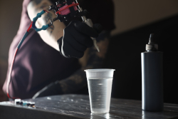 Reusable tattooing supplies being disinfected