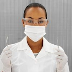 Dental assistant wearing a mask.