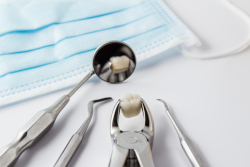 Extracted teeth and the tools to extract them.