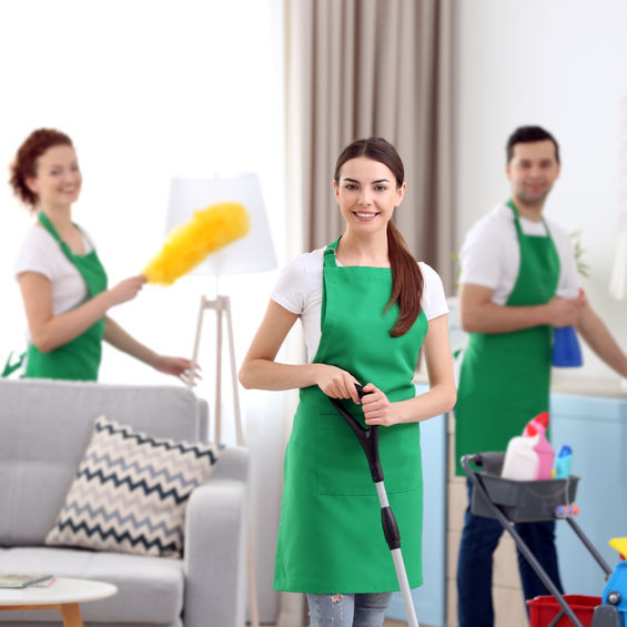 Three housecleaners working