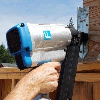 worker using a positive placement nailer