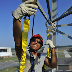 Worker attaching a yellow type y lanyard