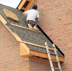 roof worker using the slide guard on roof