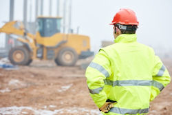 Safety manager at a construction site conducting an initial baseline survey.