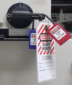 This equipment device is in the locked position before placing a lock out tag out tag