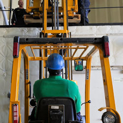  a forklift operator lifting and placing a load properly