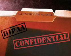 A manilla folder with the stamped words HIPAA and CONFIDENTIAL stamped on it.