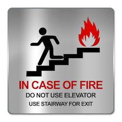 Sign on wall showing in case of fire, use stairway for exit